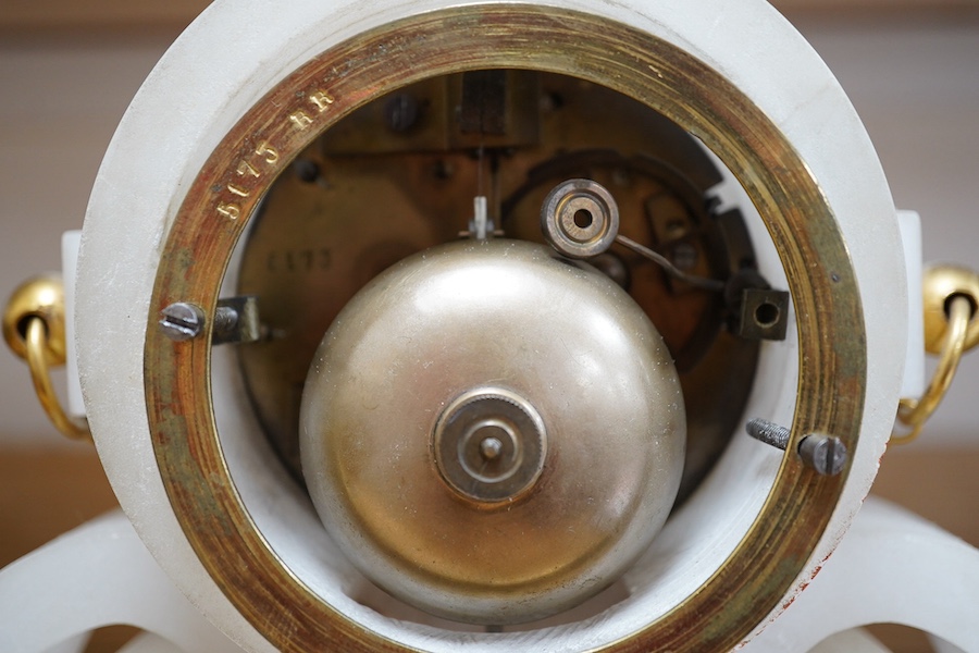 A late 19th century French ormolu mantel clock and another clock in an alabaster case, 39cm. Condition - fair to good